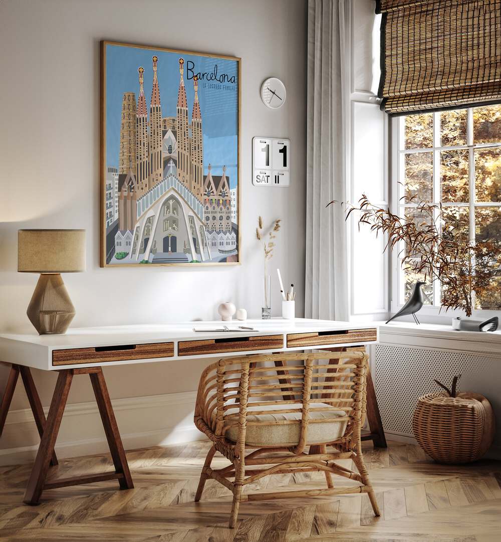 The Sagrada Familia by Carla Daly Travel Posters in Oak Wood Plain Frame placed on the wall behind a study table and beside a window