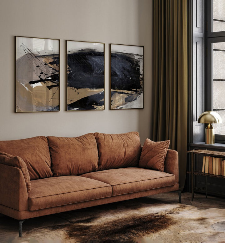 The Snap Abstraction Set Set Of 3 Paintings in Oak Wood Plain Frame placed on a living room wall behind an orange sofa and beside a window