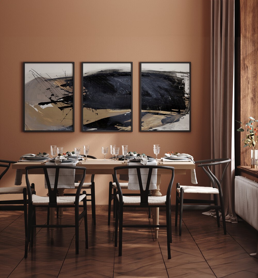 The Snap Abstraction Set Set Of 3 Paintings in Black Plain Frame placed on a wall behind a dining table and beside a window for dining area