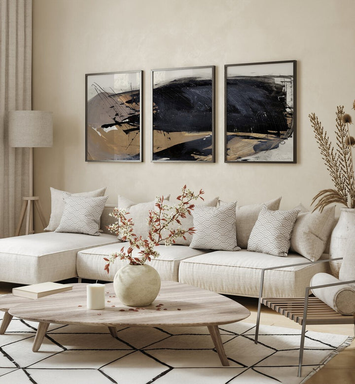 The Snap Abstraction Set Set Of 3 Paintings in Black Plain Frame placed on a living room wall behind a white sofa and beside a lamp