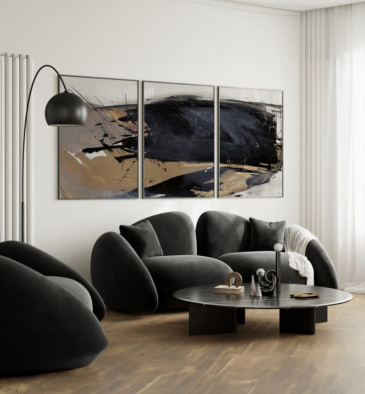 The Snap Abstraction Set Set Of 3 Paintings in Black Plain Frame placed on a living room wall behind a black sofa