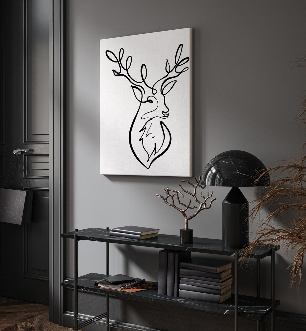 The Stag by Hanna Lee Tidd Line Art Paintings Line Art Prints in Gallery Wrap placed on a wall behind a table and a door