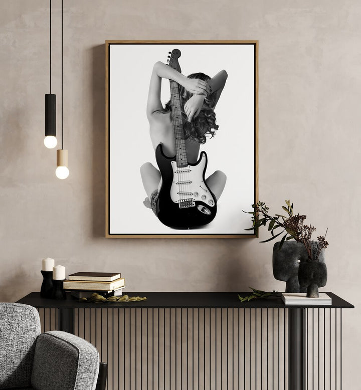 The Strat by David Drake Fine Art Photography Fashion Photography in Oak Wood Floater Frame placed on a wall behind a table