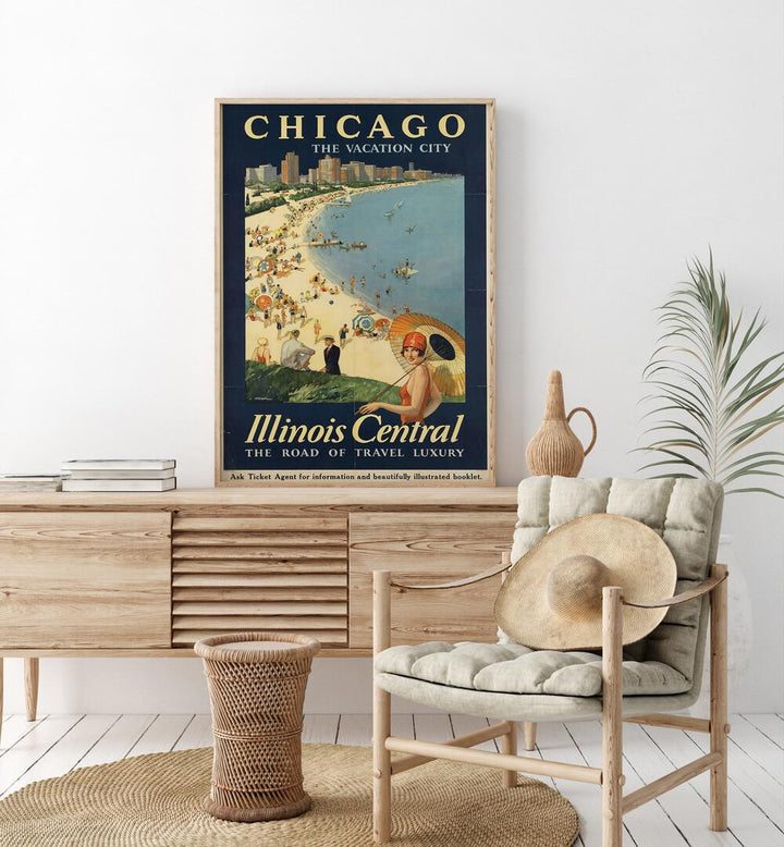 The Vacation City-Chicago Retro Vintage Travel Travel Posters in Oak Wood Plain Frame on a console table beside a plant