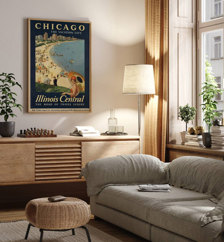 The Vacation City-Chicago Retro Vintage Travel Travel Posters in Oak Wood Plain Frame on a wall above a console table beside a lamp