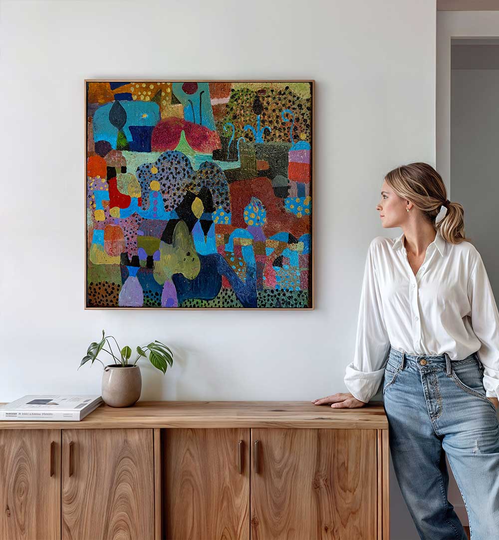 Woman viewing colorful abstract above wooden console, layered earth tones, THE VILLAGE , ABSTRACT PAINTINGS