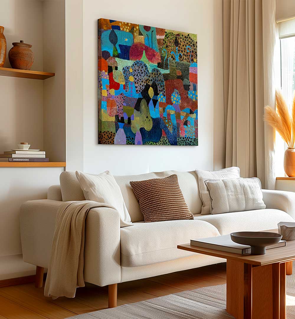 Living room with THE VILLAGE , ABSTRACT PAINTINGS canvas in warm earth tones hung above a neutral sofa