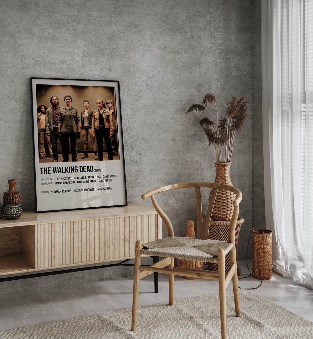 The Walking Dead 2010 I Movie Posters in Black Plain Frame placed on a console behind a chair