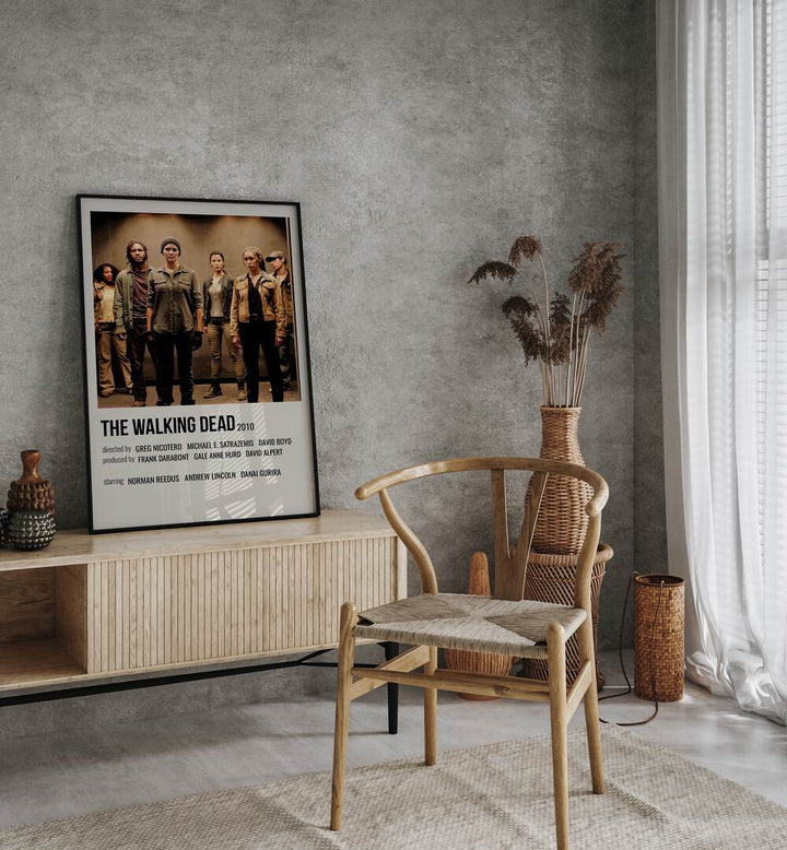 The Walking Dead 2010 I Movie Posters in Black Plain Frame placed on a console behind a chair