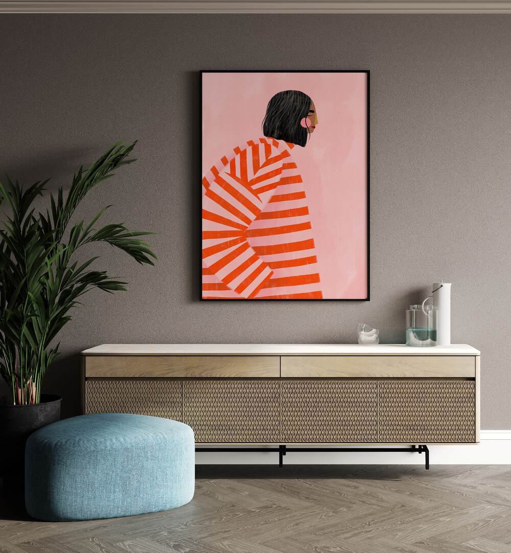 The Woman With the Ornage Stripes By Bea Muller Women Illustration Paintings in Black Plain Frame on a wall above a console beside a plant