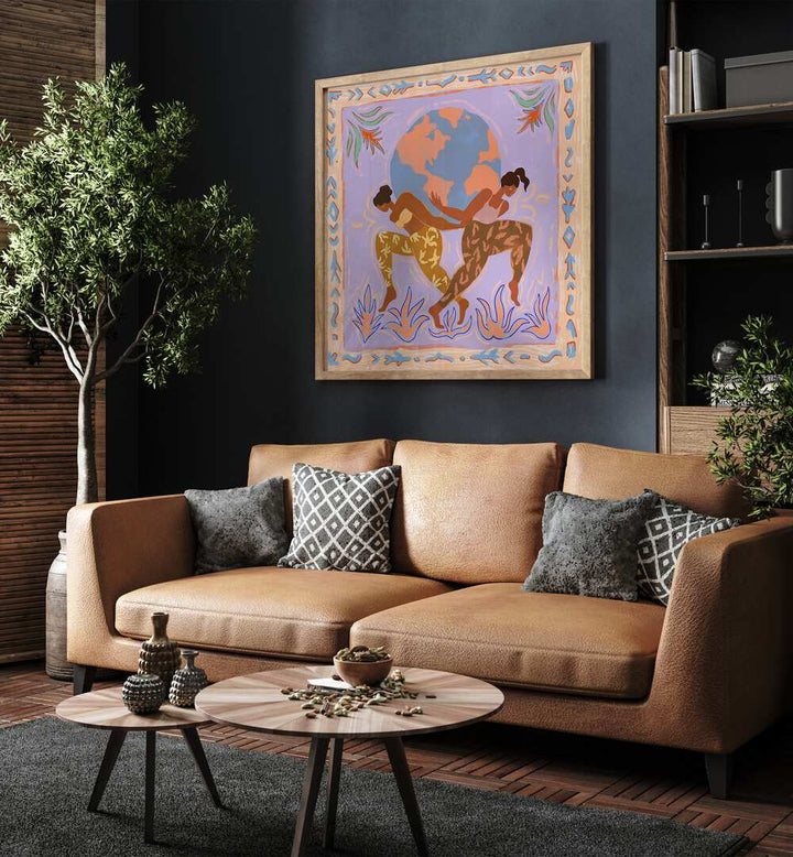 The World By Arty Guava Wall Art Prints in Oak Wood Plain Frame placed on a Blue Colored Wall near a Brown Sofa in the Living Room