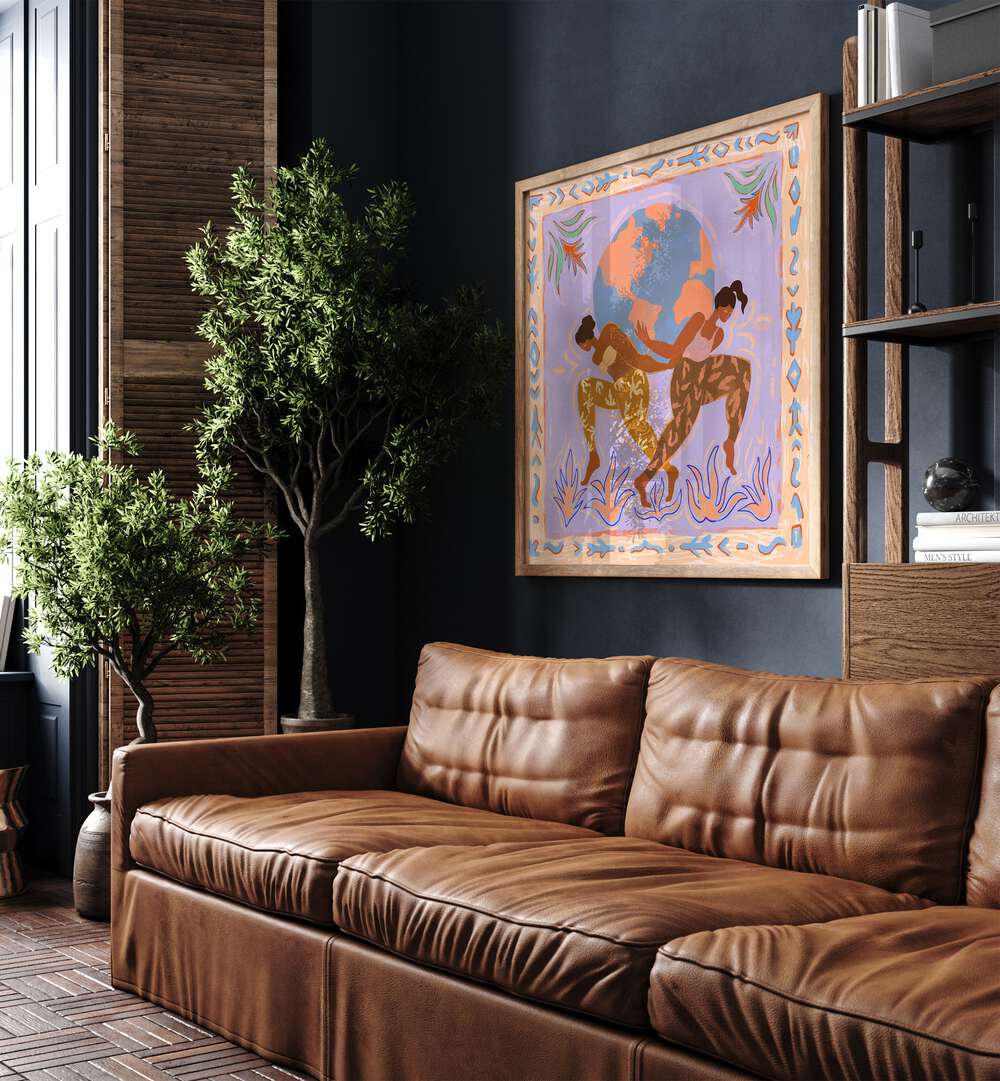 The World By Arty Guava Wall Art Prints in Oak Wood Plain Frame placed on a Blue Colored Wall near a Brown Sofa in the Living Room