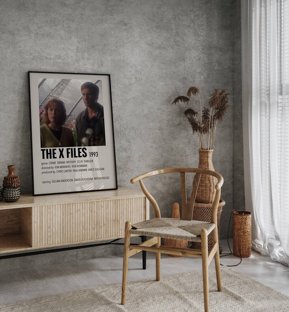 The X Files 1993 Movie Posters in Black Plain Frame placed on a console behind a chair