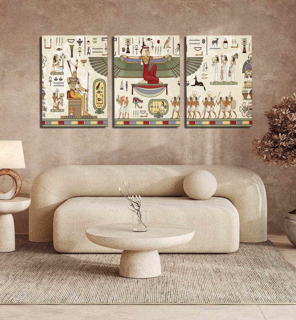 Thebes Framed Set Set Of 3 Paintings in Gallery Wrap placed on the wall behind a sofa