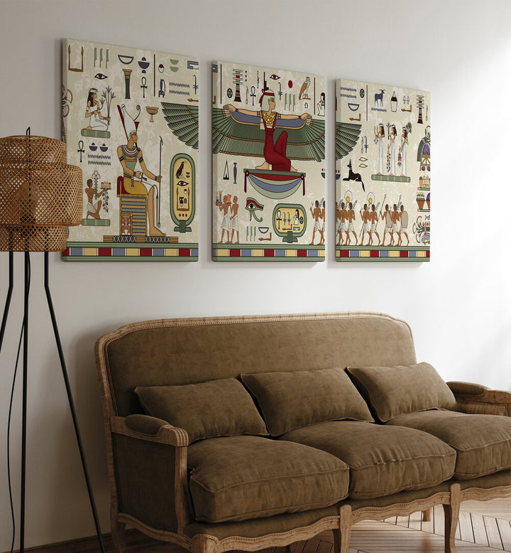 Thebes Framed Set Set Of 3 Paintings in Gallery Wrap placed on a wall behind a brown sofa