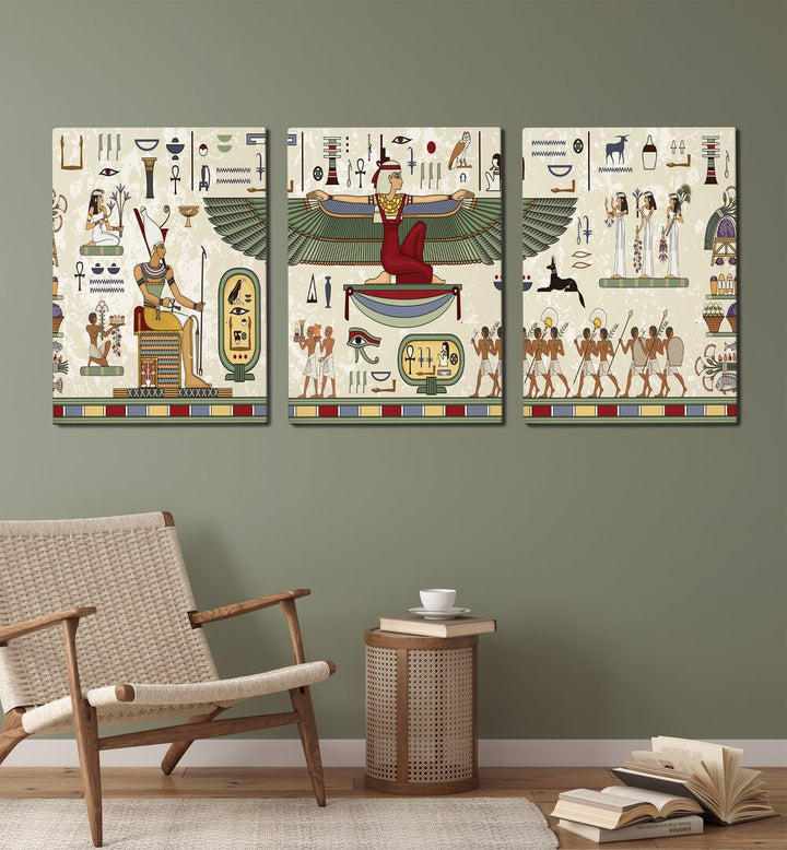 Thebes Framed Set Set Of 3 Paintings in Gallery Wrap placed on a green wall behind a chair