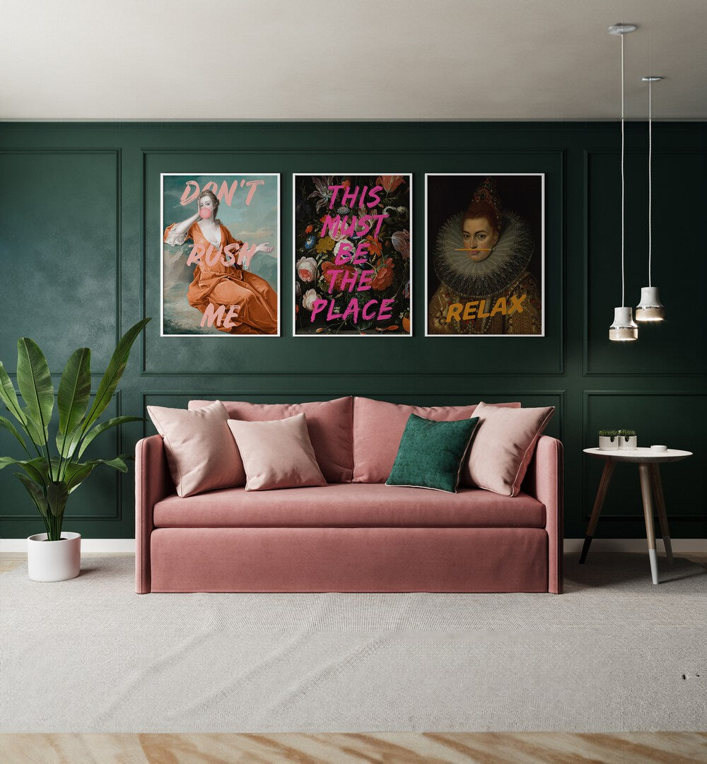 This Must Be The Place Set Set Of 3 Paintings in White Plain Frame placed on a green wall behind a pink sofa 