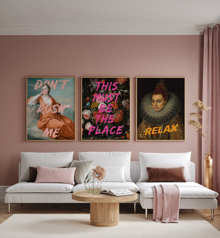 This Must Be The Place Set Set Of 3 Paintings in Oak Wood Plain Frame placed on a pink wall behind a white sofa and beside a window for living room