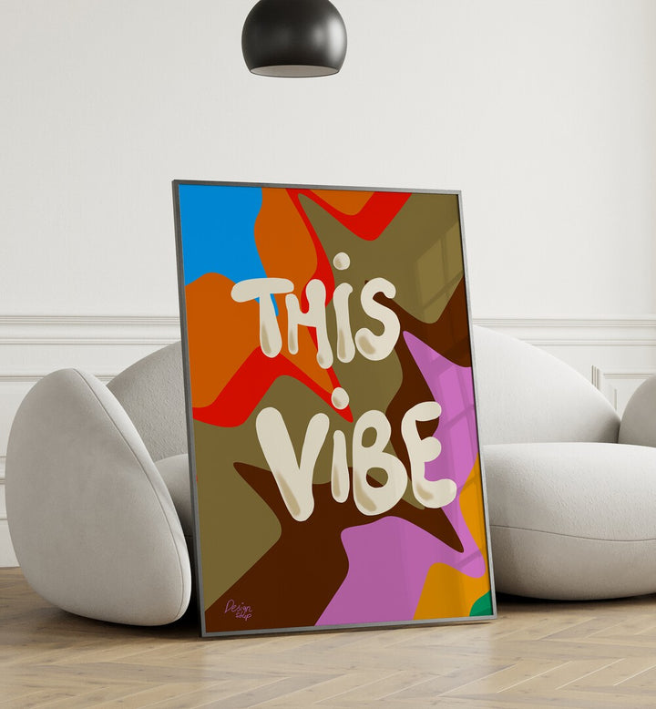 This Vibe Wall Art Prints in Black Plain Frame placed on the floor near a White Sofa in the Living Room