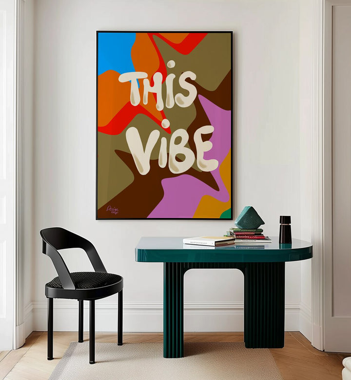 This Vibe Wall Art Prints in Black Plain Frame placed on a Cream Colored Wall near a Study Table in a Workspace in the Drawing Room