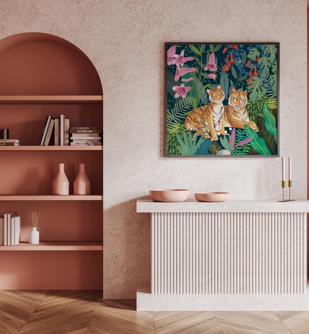 Tigers in the Jungle By Caroline Bonne Muller Wildlife Paintings in Black Plain Frame on a pink wall above a table