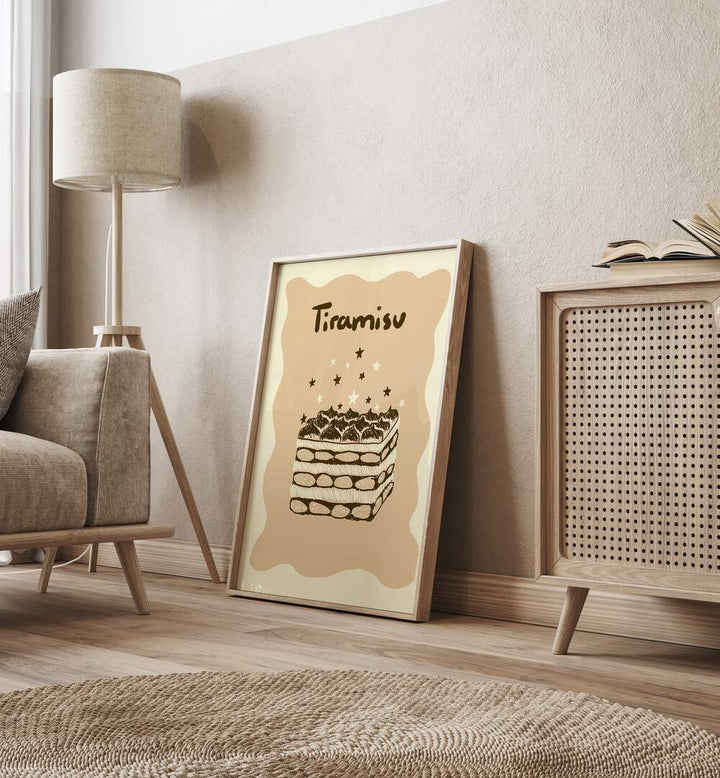 Tiramisu by Studio Dolci Kitchen Posters in Oak Wood Plain Frame placed on the floor beside a sofa