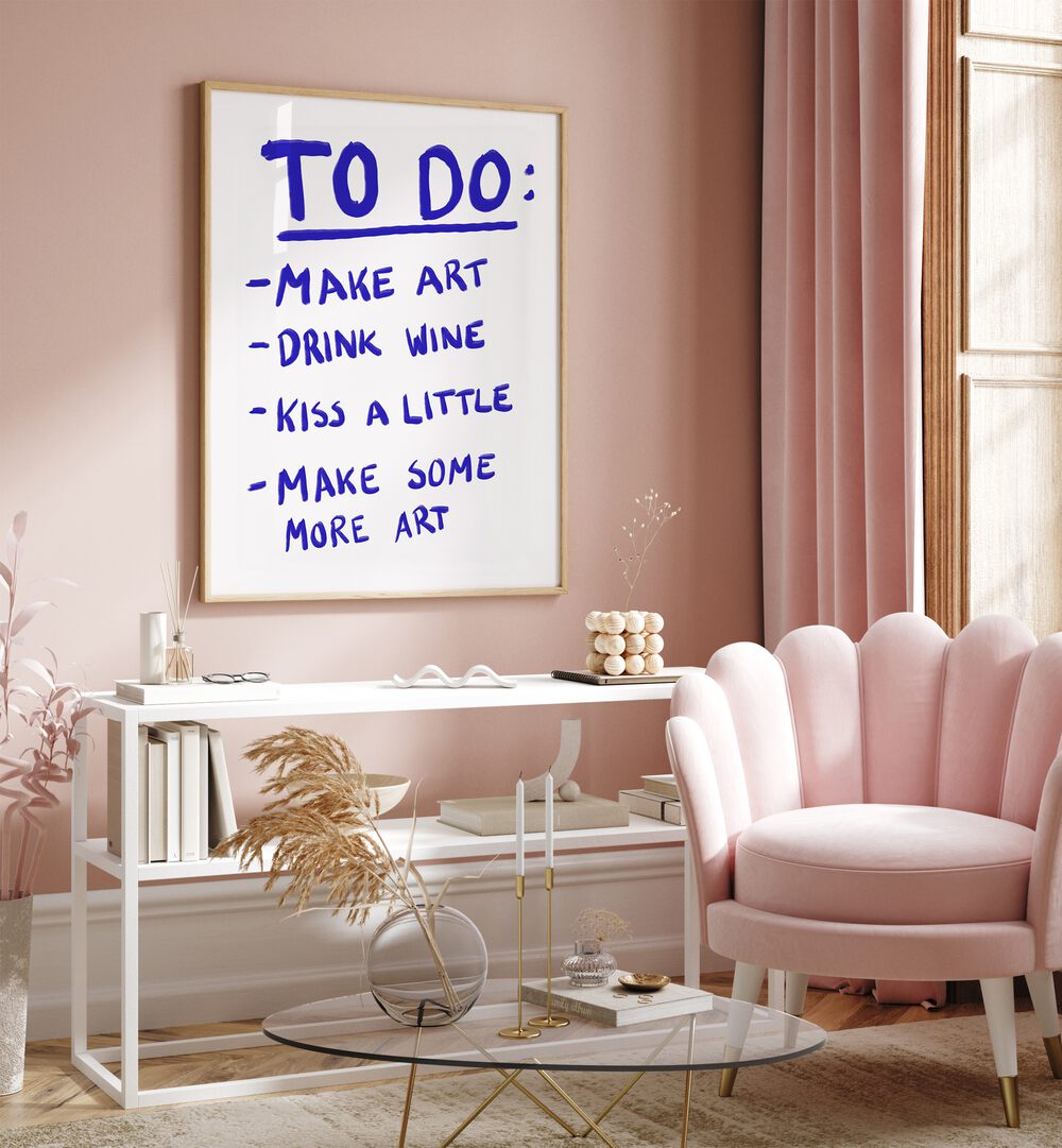 To Do List by Athene Fritsch Quotes and Typography Posters in Oak Wood Plain Frame placed on a pink wall beside a window and behind a table