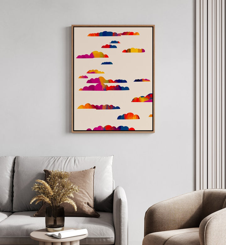 Totem Clouds By Uma Gokhale Abstract Paintings in Oak Wood Floater Frame on a white wall behind a sofa