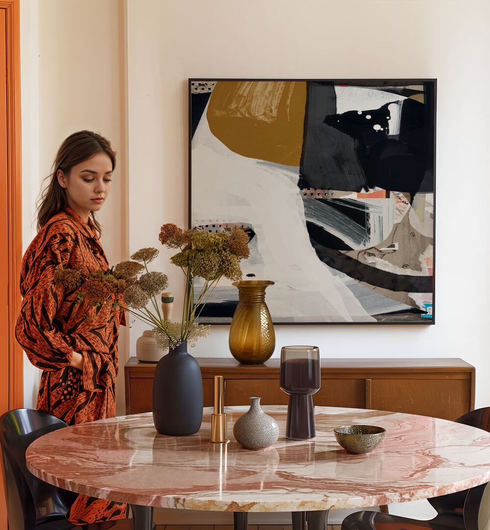 Trading By Dan Hobday Abstract Art Abstract Paintings in Black Plain Frame placed on a Cream Colored Wall near a Dining Table in the Dining Room