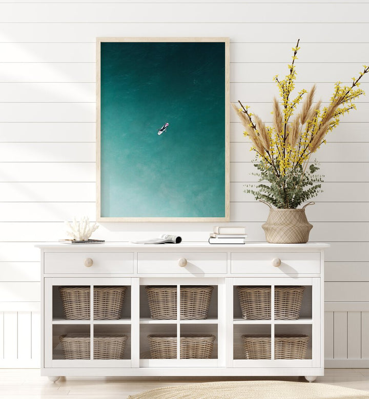 Tranquility Beach Prints Coastal Wall Art in Oak Wood Plain Frame placed on a White Colored Wall  above a Console Table in the Alley Way