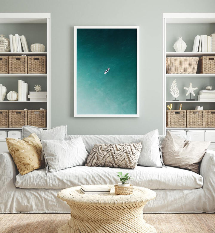 Tranquility Beach Prints Coastal Wall Art in White Plain Frame placed on a Grey Colored Wall in the Living Room 