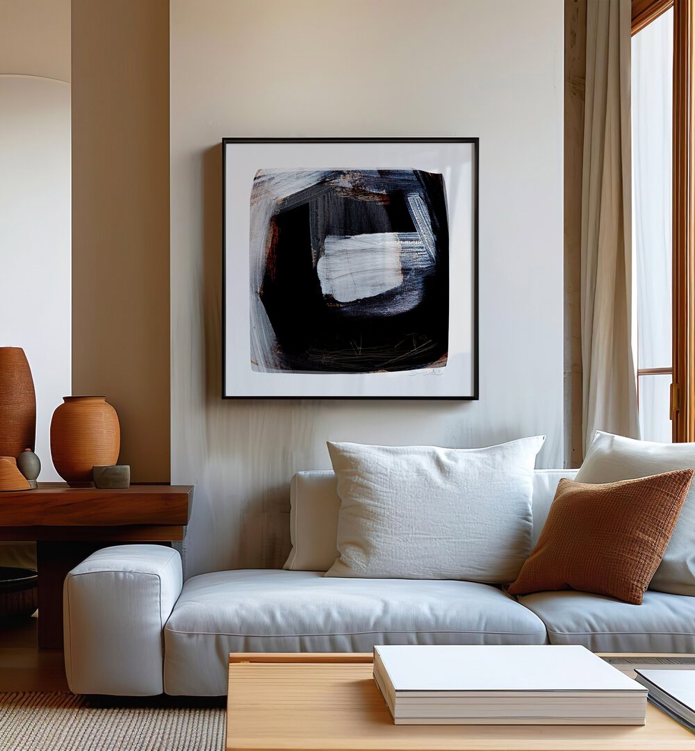 Trapped By Dan Hobday Abstract Art Abstract Paintings in Black Plain Frame placed on a Cream Colored Wall near a White Sofa in the Living Room