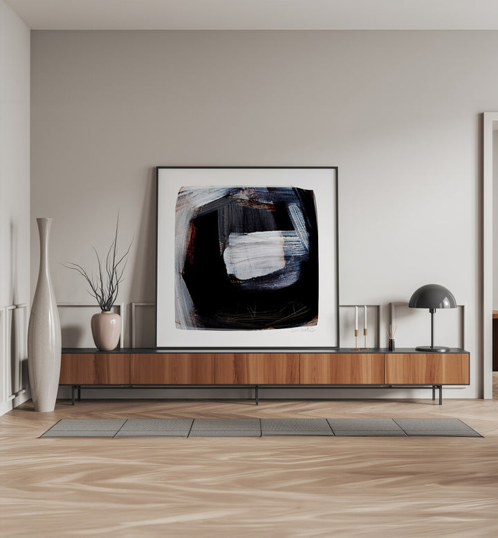 Trapped By Dan Hobday Abstract Art Abstract Paintings in Black Plain Frame placed on a Console Table near a Cream Colored Wall in the Drawing Room