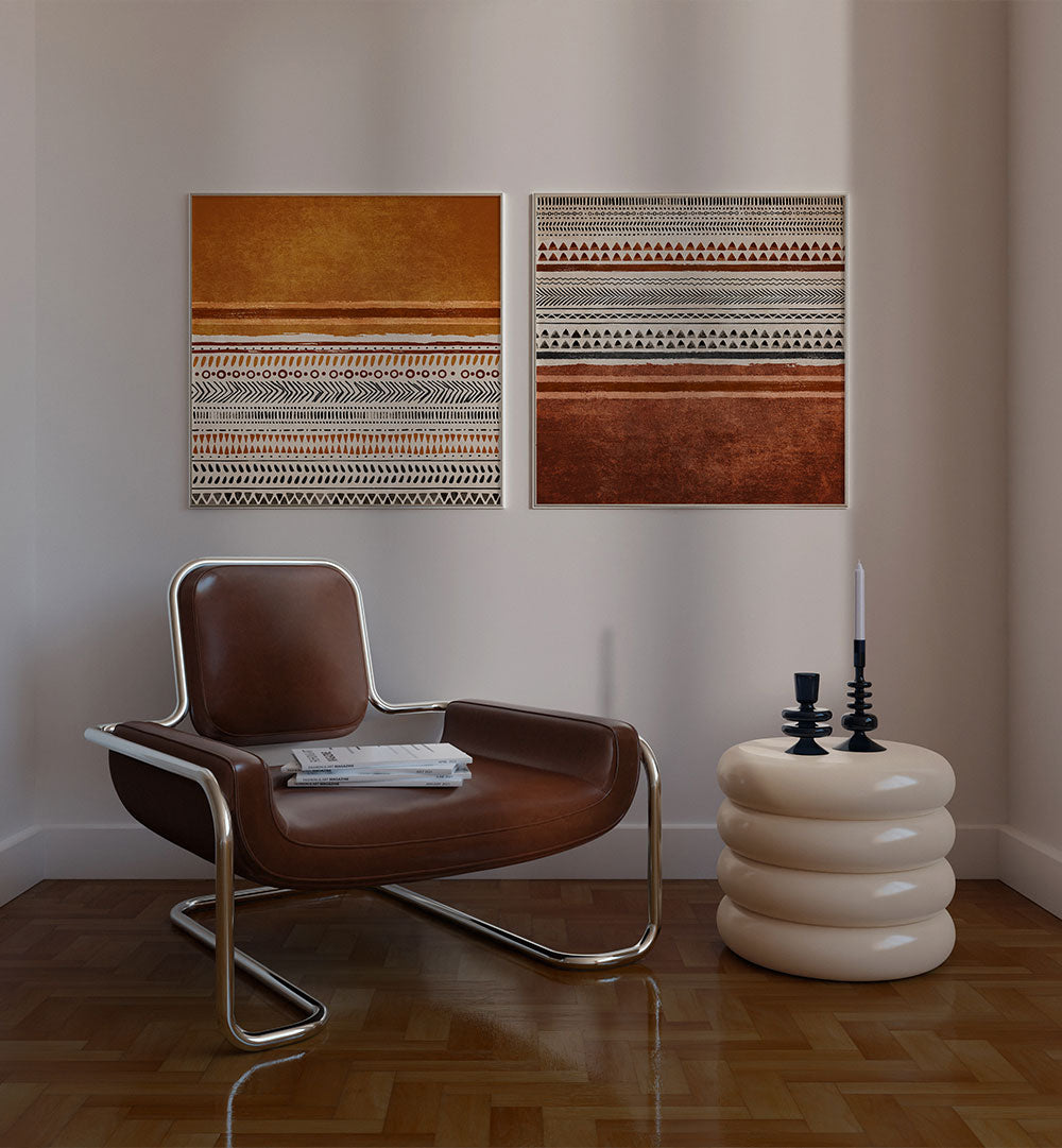 Modern interior with a brown chair, white side table, and abstract wall art.
