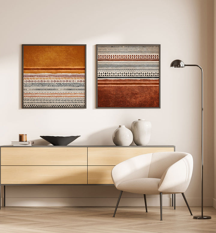 Modern interior with a wooden sideboard, white chair, and abstract wall art.