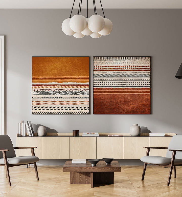 Modern living room with two abstract art pieces on a gray wall.