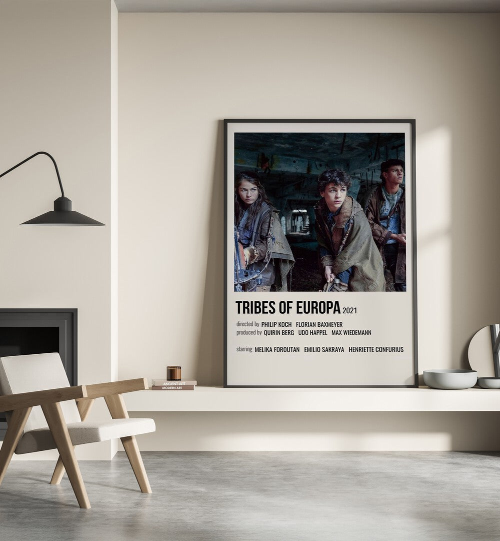 Tribes Of Europa 2021 Movie Posters in Black Plain Frame placed on a shelf beside a hearth