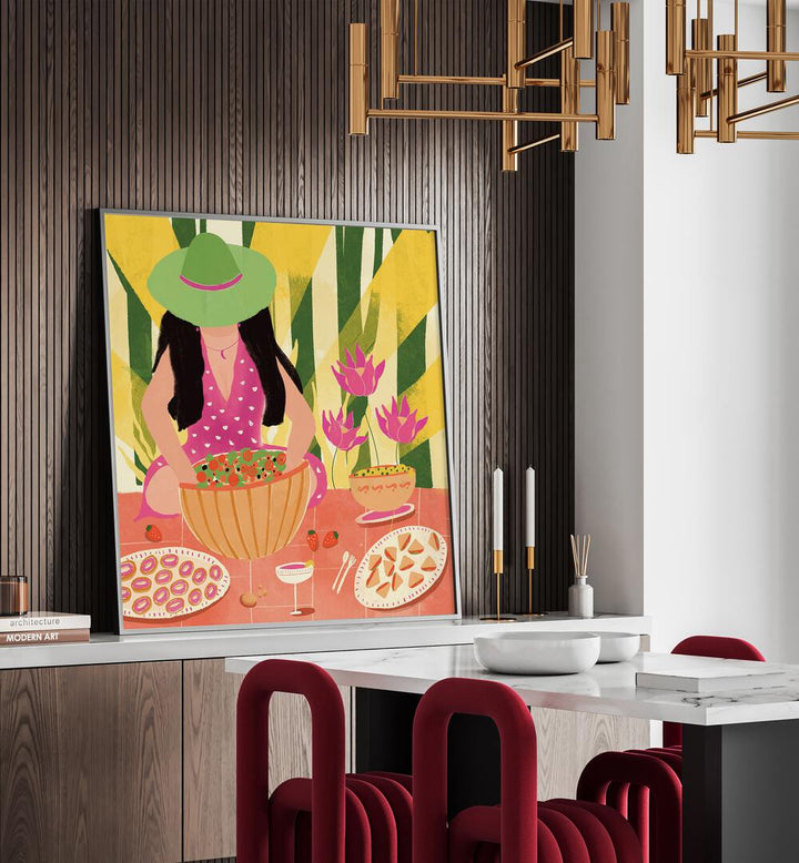 Tropical Picnic by Shriya Bhattacharya Women Illustration in Black Plain Frame on a console table behind a dining table