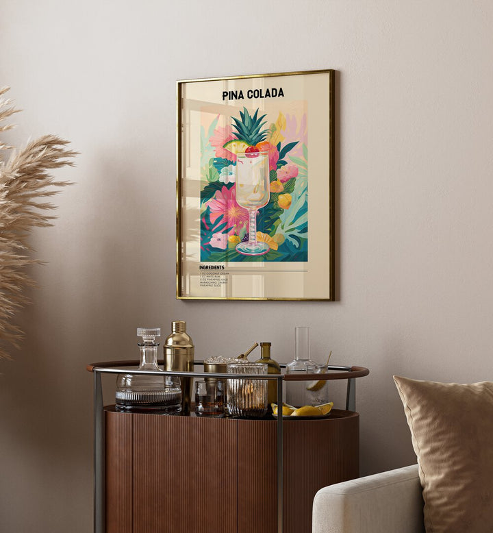 Tropical Pina Colada Cafe Art Prints Cafe Posters in Gold Plain Frame placed on a wall behind a table