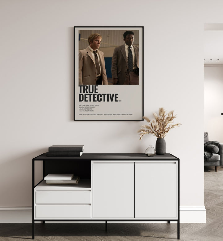 True Detective 2014 Movie Posters in Black Plain Frame placed on a white wall behind a table