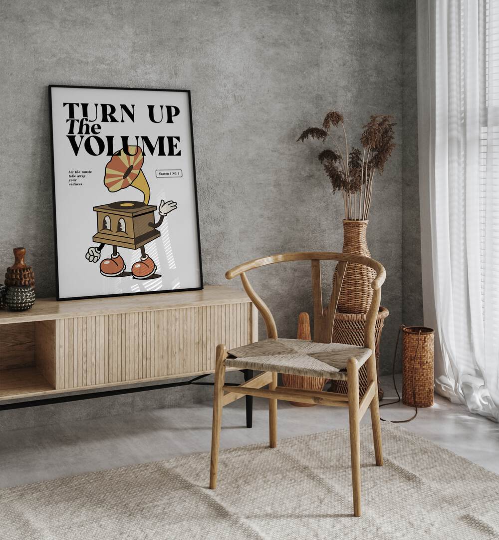 Turn Up the Volume Quotes and Typography Posters in Black Plain Frame placed on a wall behind a console table