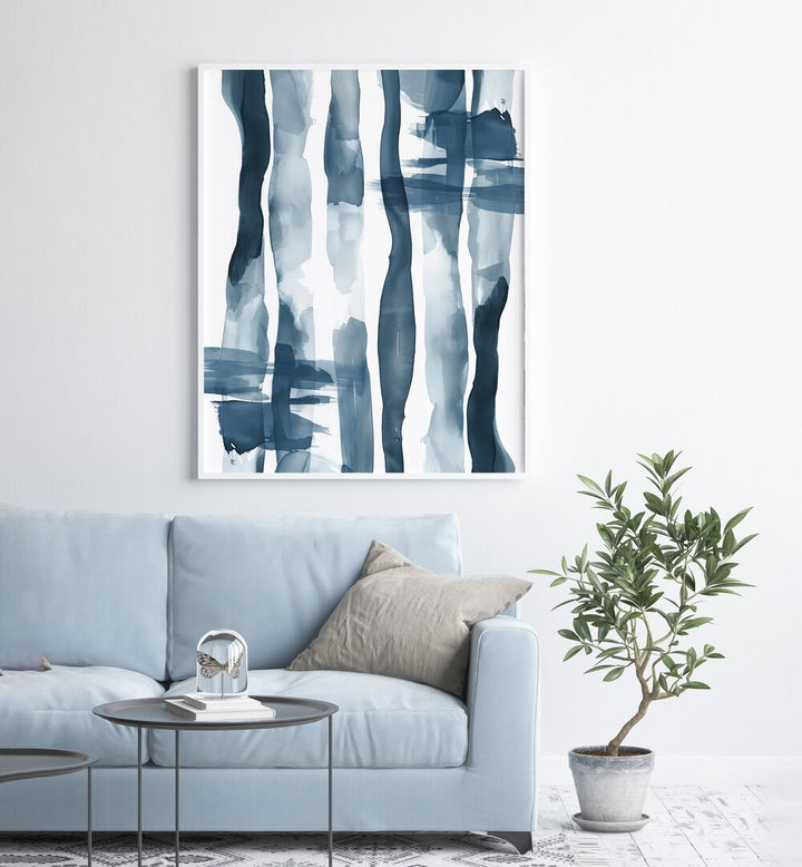 Turquoise Tides Beach Prints Coastal Wall Art in White Plain Frame placed on a White Colored Wall near a Blue Sofa in the Living Room