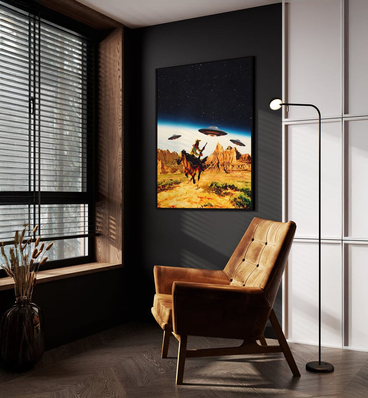 UFO Space Surreal Paintings Surreal Art Prints in Black Plain Frame placed on a Dark Grey Colored Wall near a Brown Sofa Chair in the Drawing Room