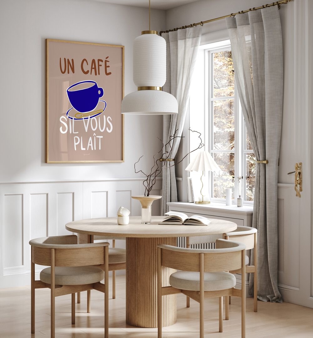 Un Cafe Cafe Art Prints Cafe Posters in Oak Wood Plain Frame placed on a White Colored Wall near a Coffee Table in the Dining Room