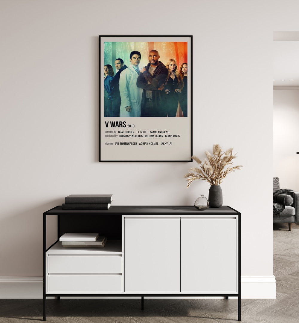 V Wars 2019 Movie Posters in Black Plain Frame placed on a wall behind a black and white table