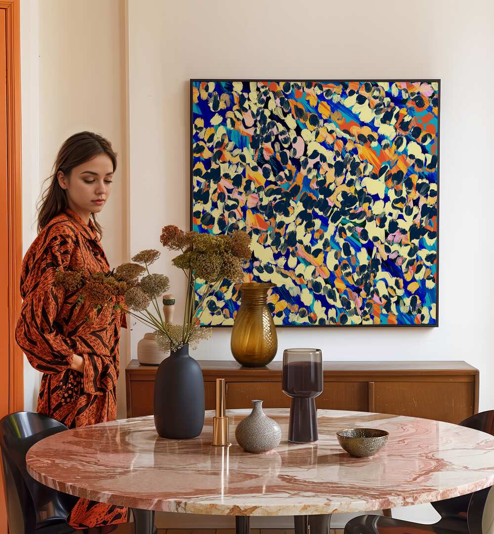 Stylish woman admires VINTAGE COLLAGE, ABSTRACT PAINTINGS, adding creativity and nostalgia to her elegant space.