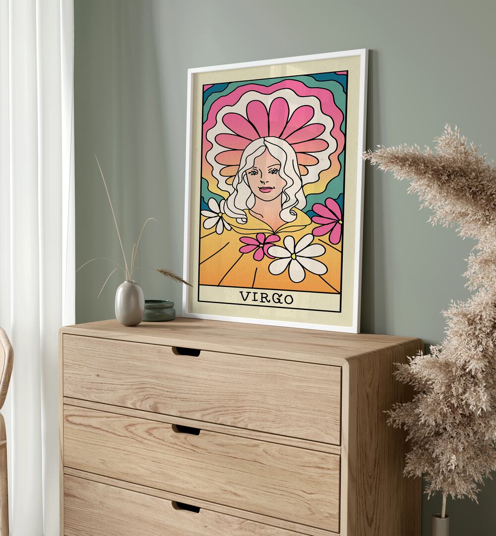 Virgo Zodiac & Tarot Art Painting Artwork in plain white frame on a console table beside a plant