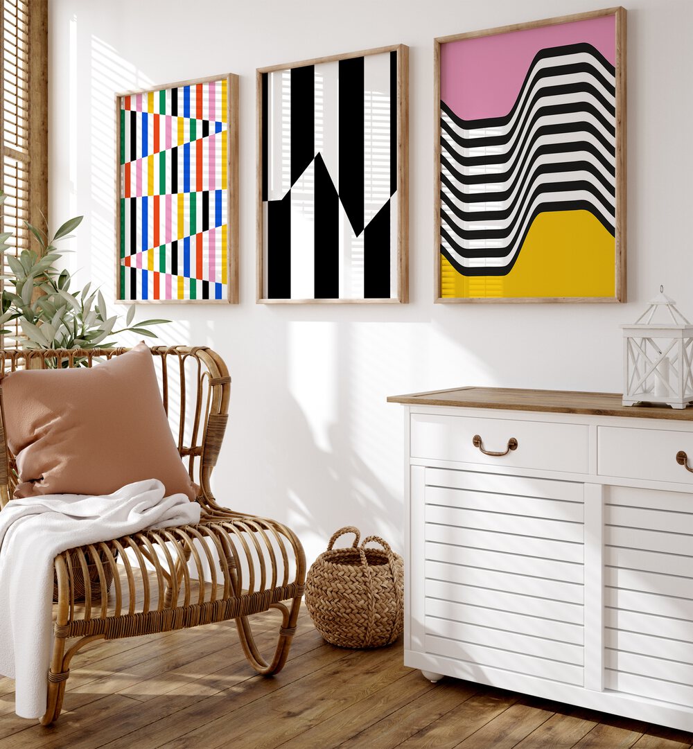 Vibrant Colors Set Set Of 3 Paintings in Oak Wood Plain Frame placed on a wall behind a chair and a console table