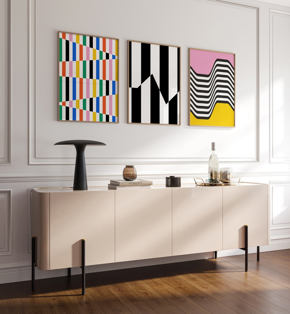 Vibrant Colors Set Set Of 3 Paintings in Oak Wood Plain Frame placed on a wall behind a console table