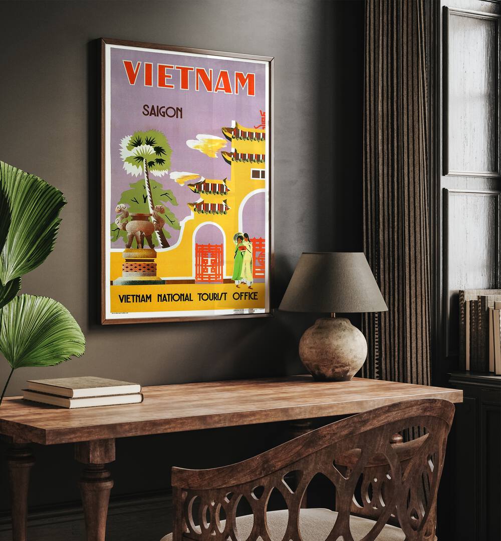 Vietnam National Tourist Office  Vintage Travel Posters in Oak Wood Plain Frame placed on a wall behind a study table